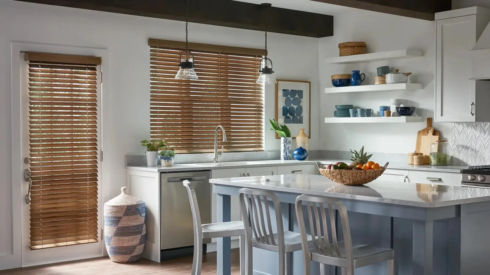 Faux wood blinds installed in a bright kitchen by a Venbit client